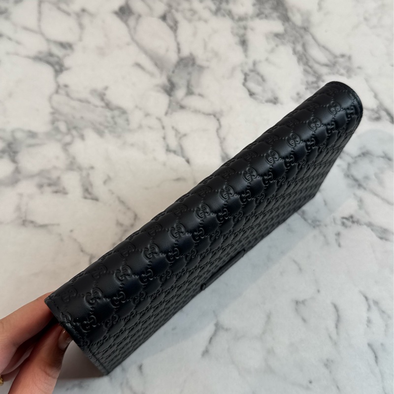 Gucci黑壓紋釦式手拿包/長夾/斜背包-1