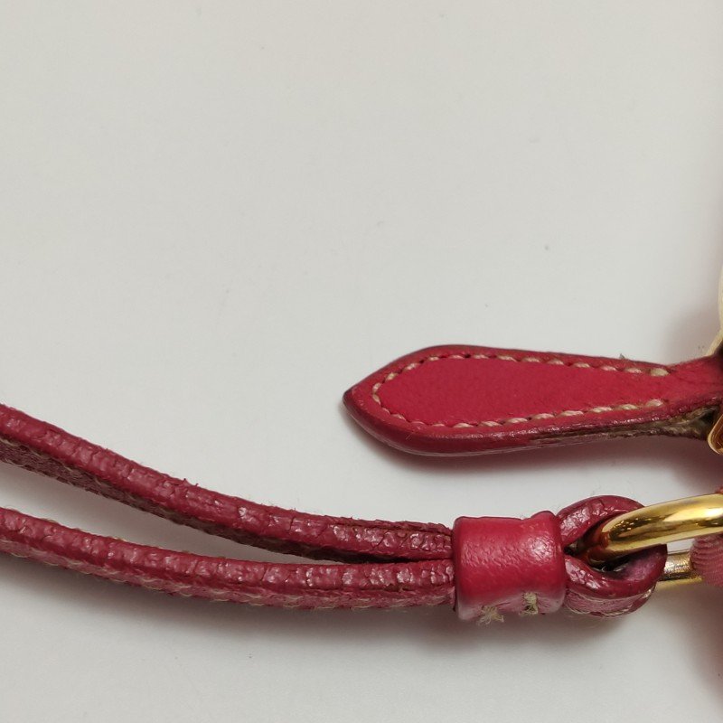 Prada羊皮尼龍布純色蝴蝶結裝飾字母logo手拿包-12