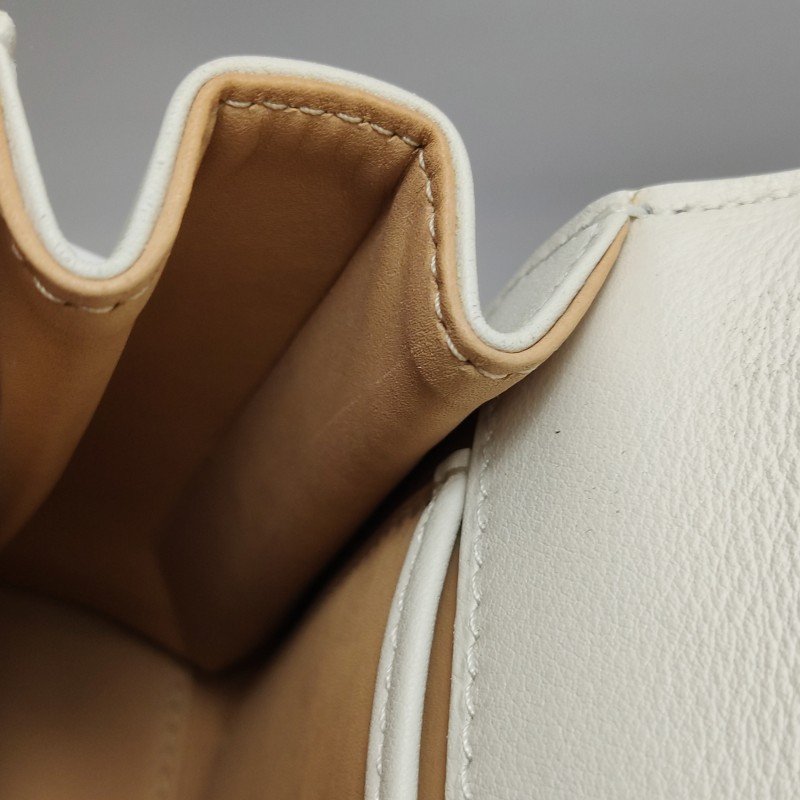 Delvaux Tempete小號牛皮純色浮雕圖騰T形翻蓋手提包單肩包-9