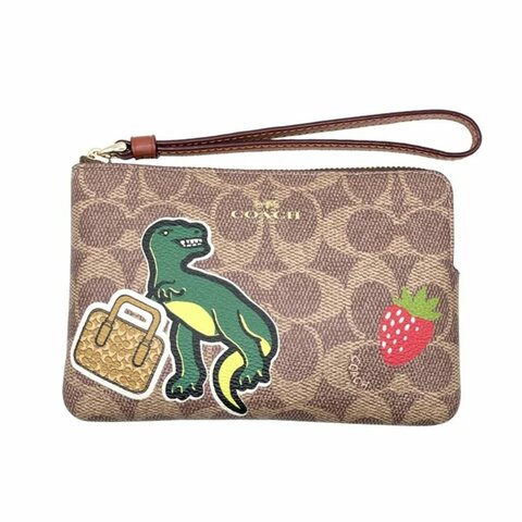 【COACH】趣味印花手拿包-恐龍骰子