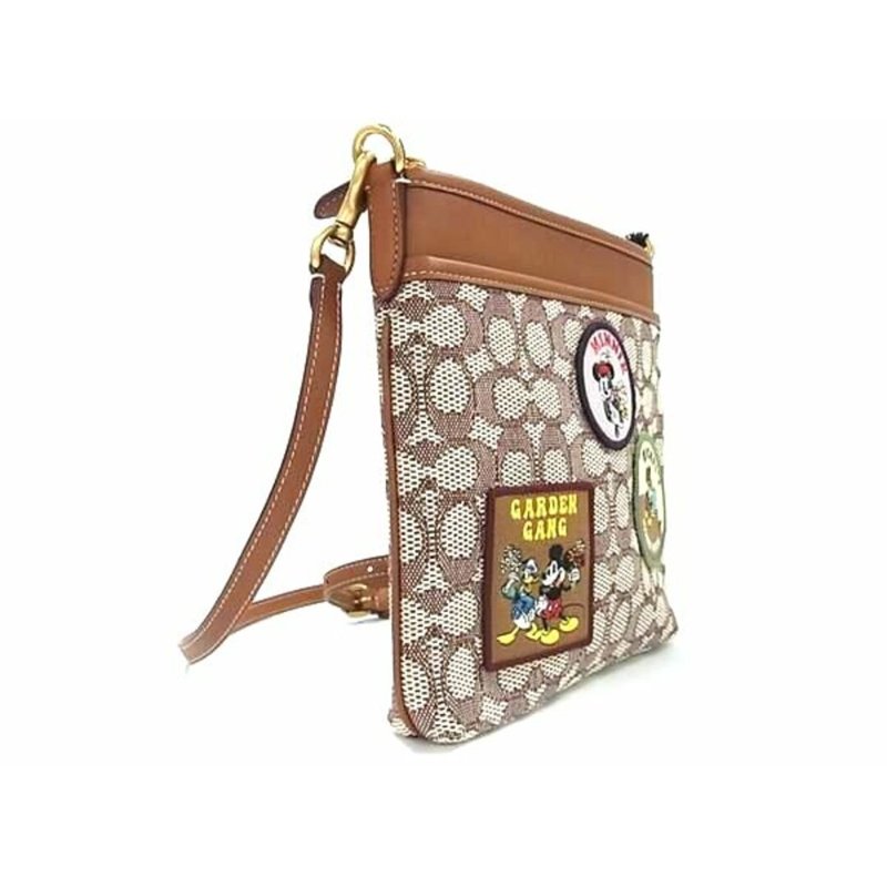 【COACH】滿版LOGO迪士尼聯名斜背方包-米奇緹花-1