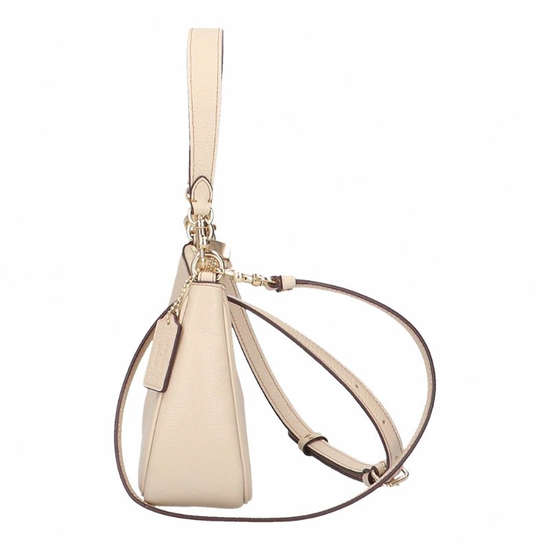 【COACH】史努比聯名款皮革肩斜背兩用彎月包-米白-1