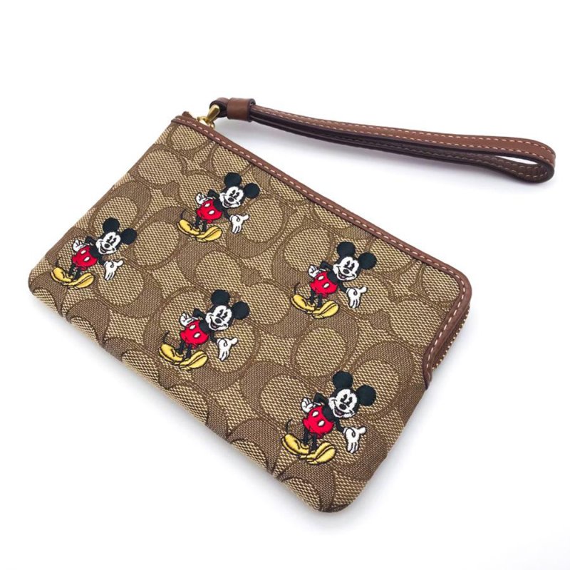 【COACH】印花防刮PVC皮革L型拉鍊手拿包-迪士尼-1