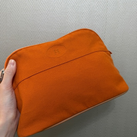 Hermes 橙色帆布銀釦收納化妝包
