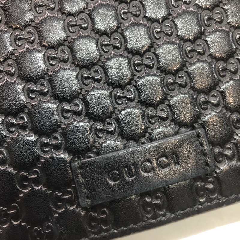 GUCCI 壓紋黑色牛皮細logo WOC XB724-26