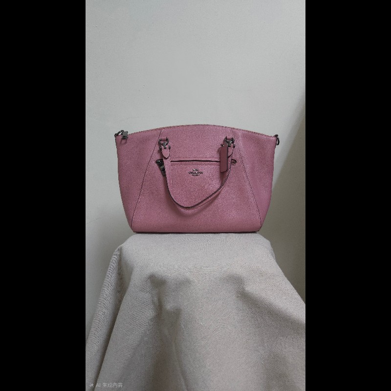 Coach 粉色手提水餃包-1