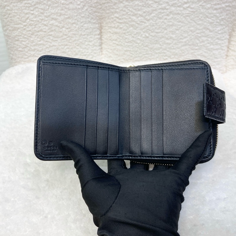 Gucci黑色經典Guccissima壓紋牛皮零錢層釦中短夾449395-8