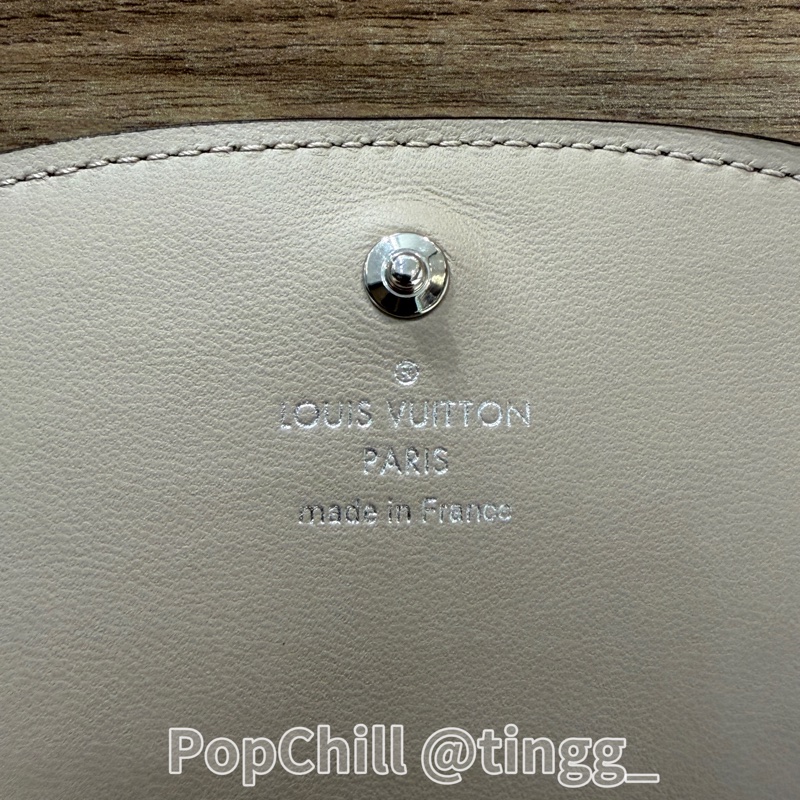 LV 石灰色打孔通花Iris銀釦下蓋短夾M62542-12