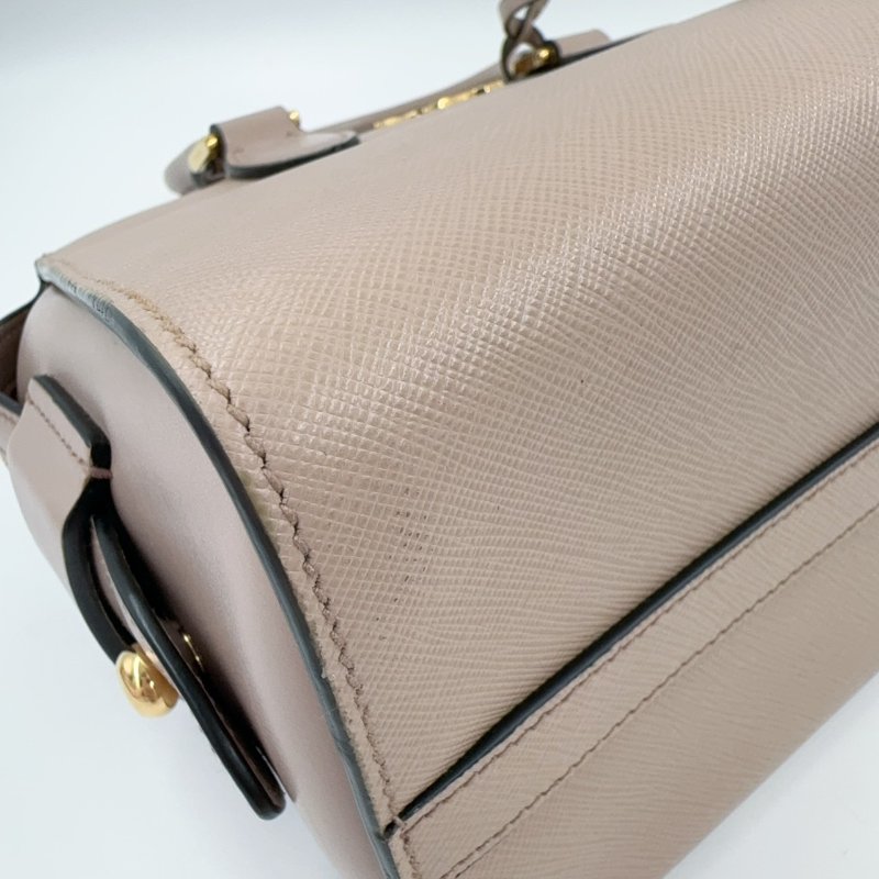 PRADA粉膚防刮牛皮金釦手提側背殺手包1BA164-8