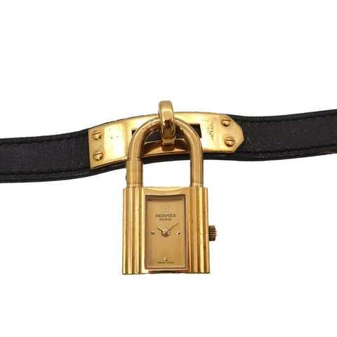 愛馬仕凱莉女士腕錶，金色和黑色石英錶，帶掛鎖