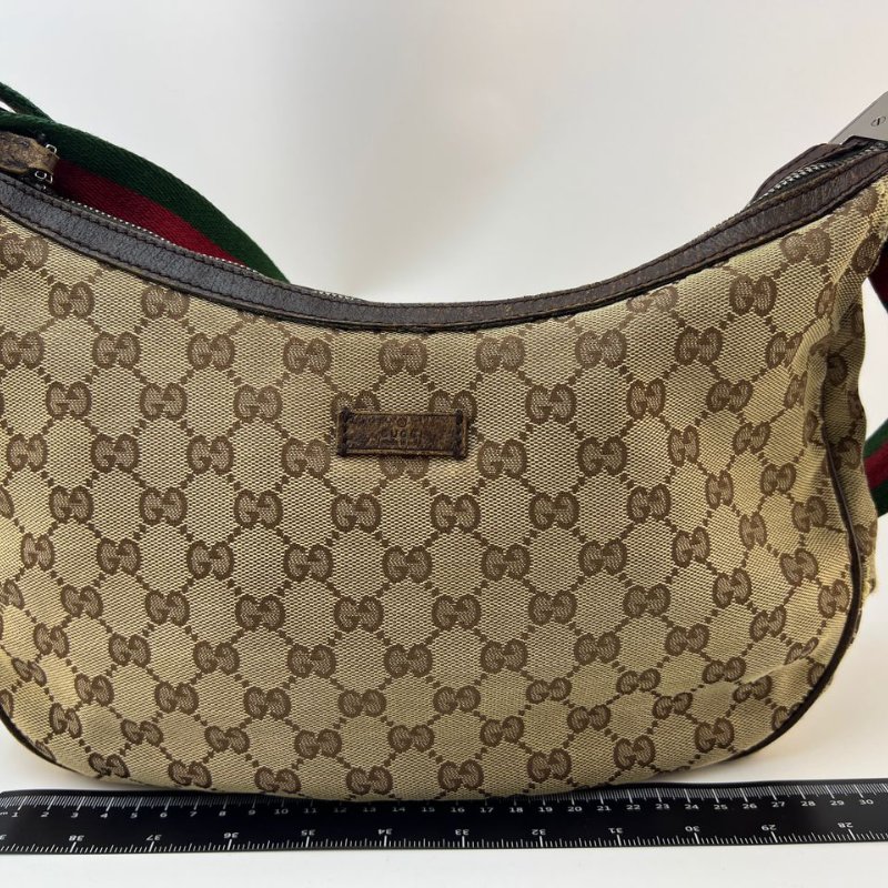 Gucci 經典雙 G 帆布月牙形斜挎包-0