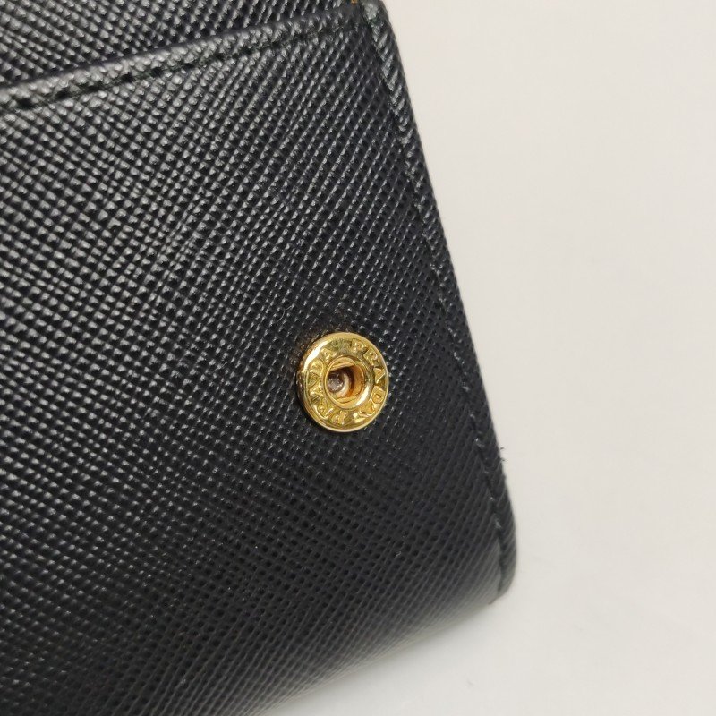 Prada牛皮純色字母Logo蝴蝶結裝飾皮夾-9