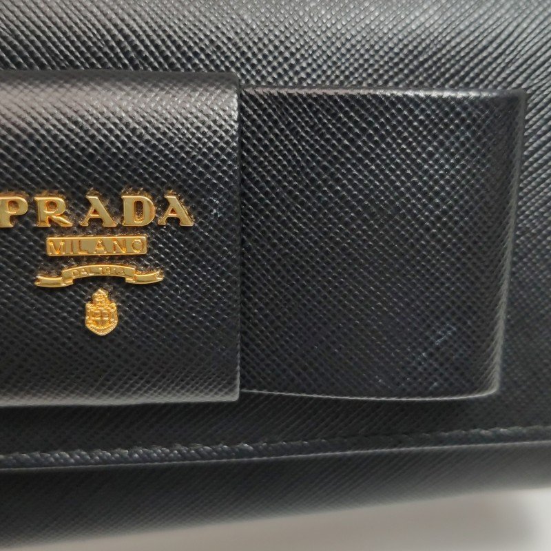 Prada牛皮純色字母Logo蝴蝶結裝飾皮夾-12