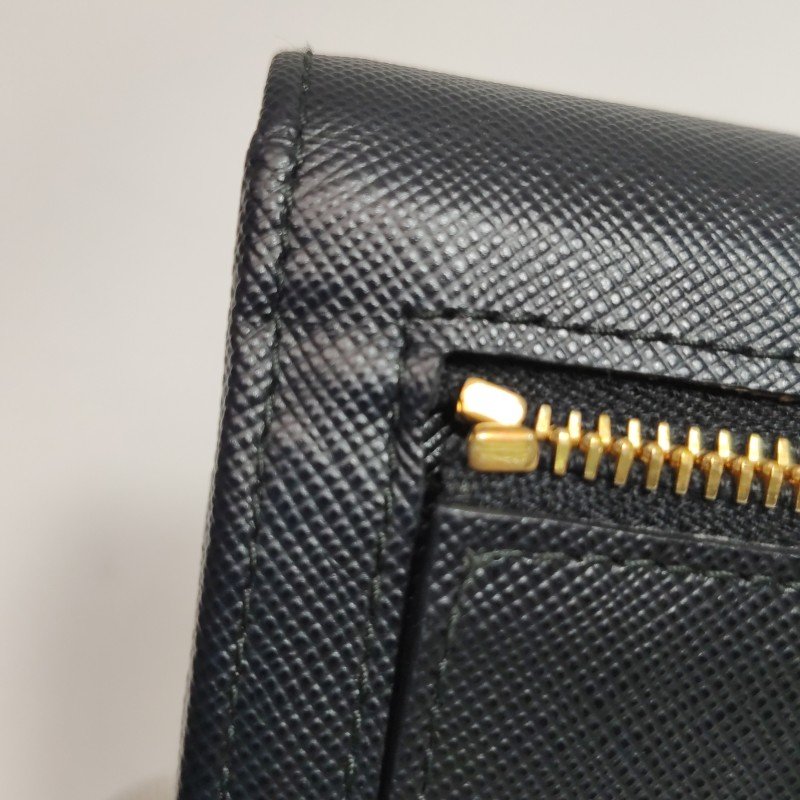 Prada牛皮純色字母Logo蝴蝶結裝飾皮夾-13