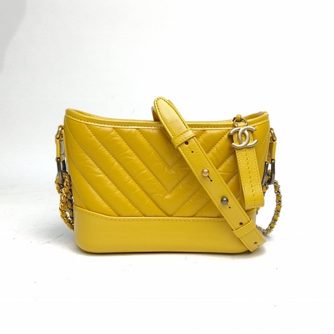 CHANEL GABRIELLE流浪小號黃色牛皮28開金銀扣V紋