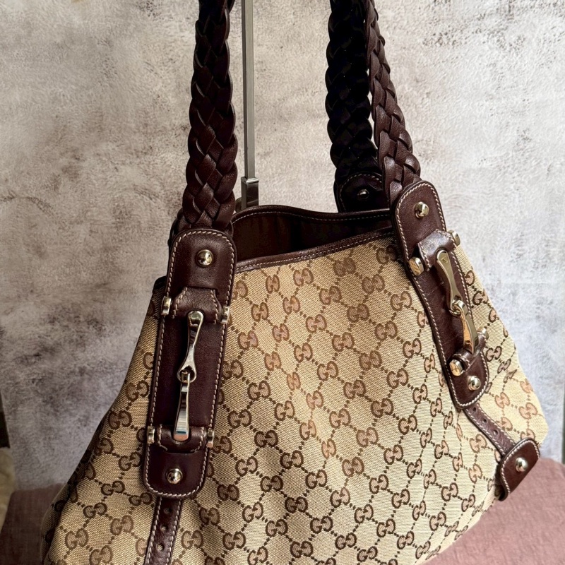 Gucci 最具代G表性的「編織帶緹花布馬銜包」-1