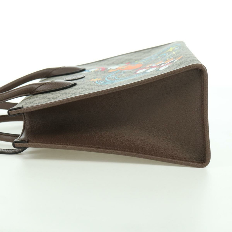 【日本直送】GUCCI GG Supreme 唐老鴨迪士尼聯名款 PVC 雙面米色 648134 正品 BAZ859SM-2