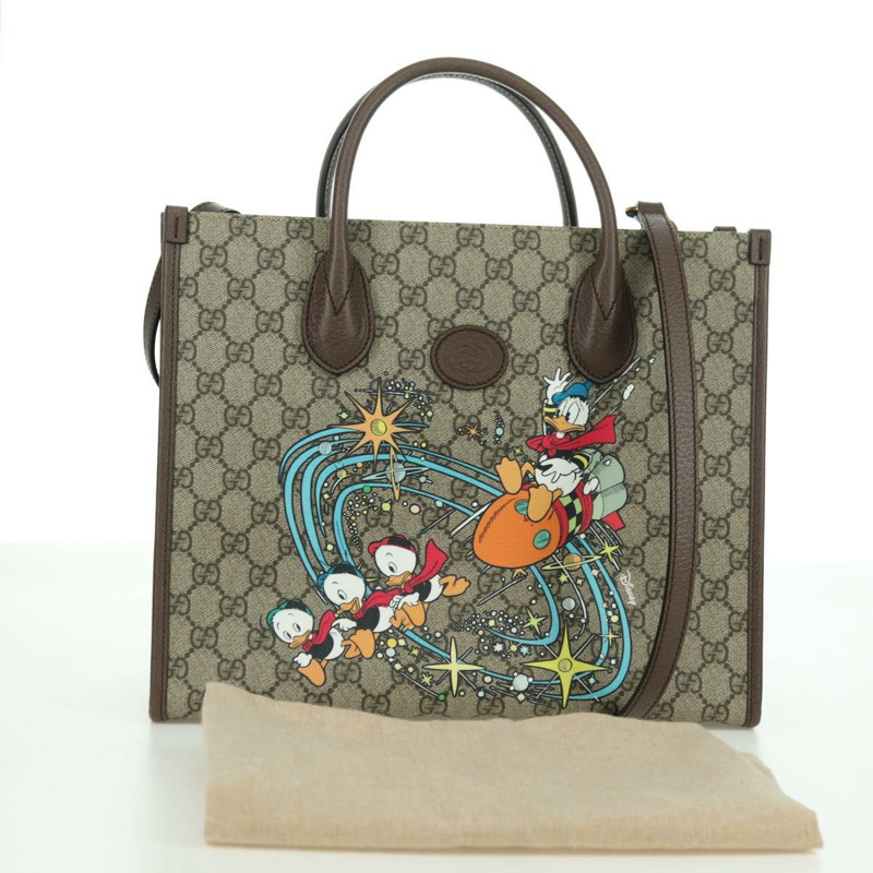 【日本直送】GUCCI GG Supreme 唐老鴨迪士尼聯名款 PVC 雙面米色 648134 正品 BAZ859SM-11