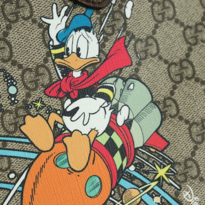 【日本直送】GUCCI GG Supreme 唐老鴨迪士尼聯名款 PVC 雙面米色 648134 正品 BAZ859SM-19