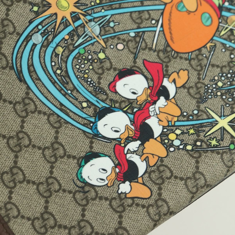 【日本直送】GUCCI GG Supreme 唐老鴨迪士尼聯名款 PVC 雙面米色 648134 正品 BAZ859SM-20