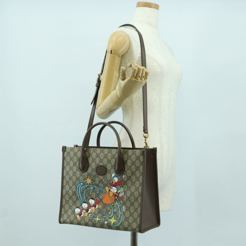 【日本直送】GUCCI GG Supreme 唐老鴨迪士尼聯名款 PVC 雙面米色 648134 正品 BAZ859SM-26