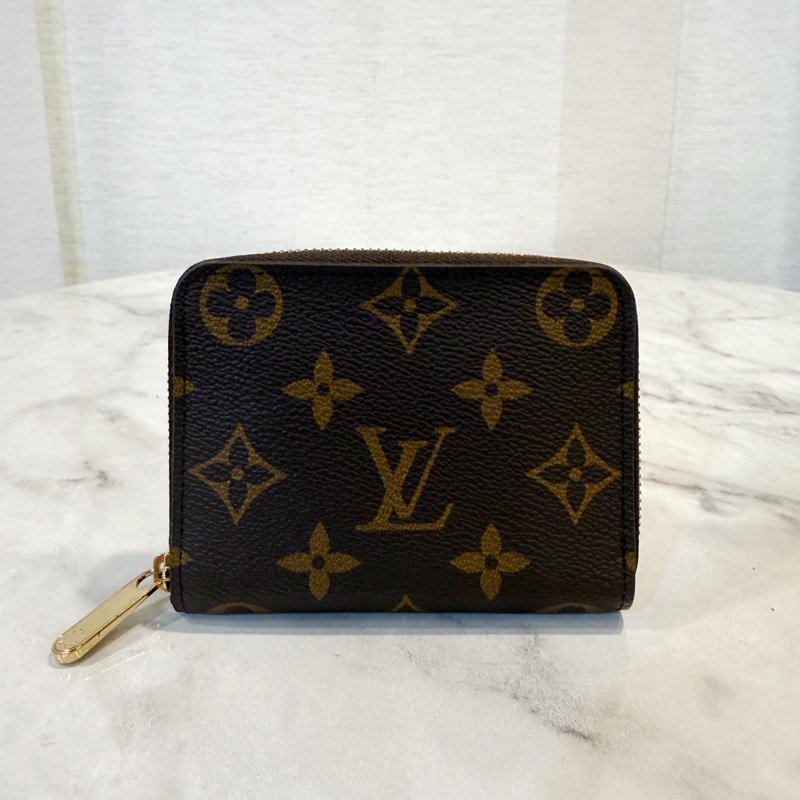LV 原花金釦ㄇ拉零錢卡包M60067-0