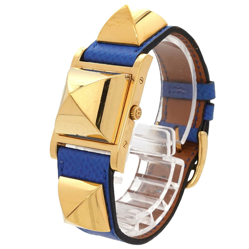 愛馬仕 Medor 女士腕錶，金字塔設計，金色鉚釘，白色和藍色皮革錶帶，石英機芯。-1