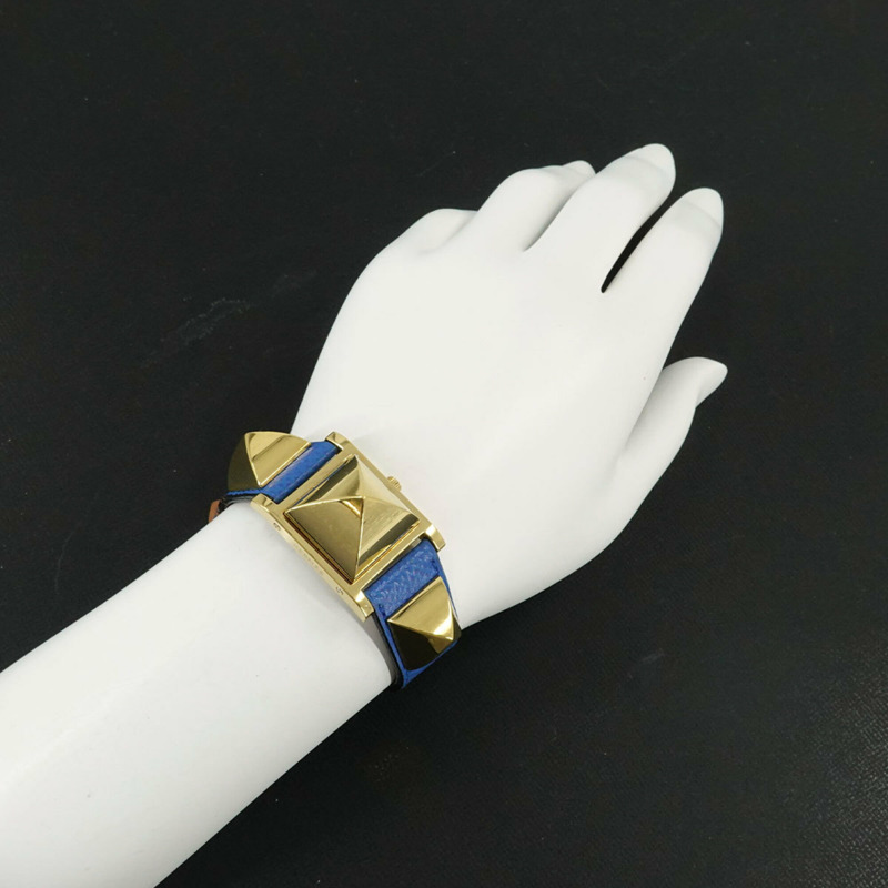 愛馬仕 Medor 女士腕錶，金字塔設計，金色鉚釘，白色和藍色皮革錶帶，石英機芯。-2