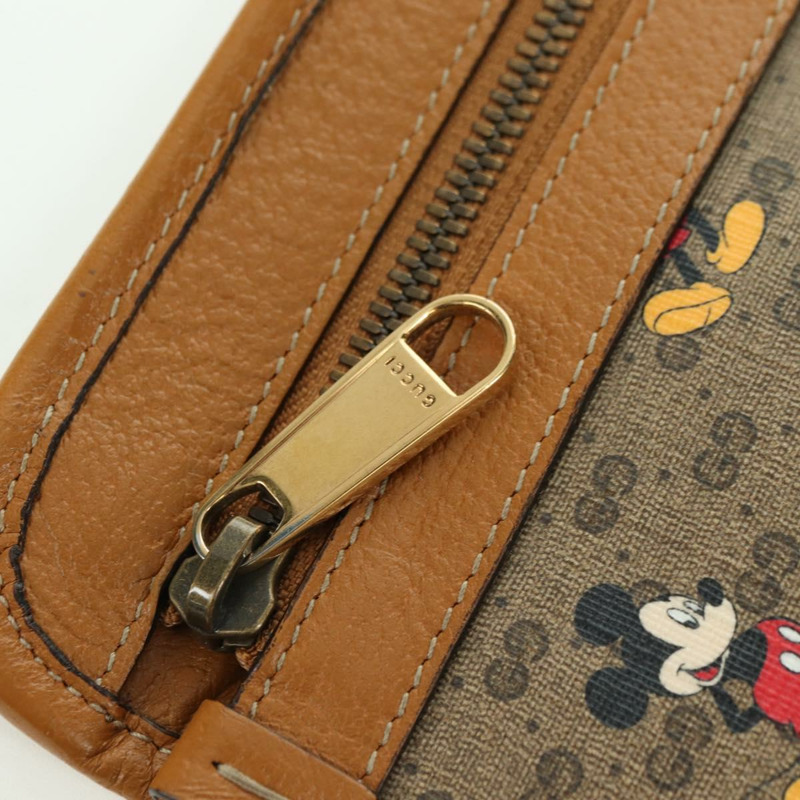【日本直送】GUCCI GUCCIxDisney GG Supreme 手拿包 PVC 米色金色 602552 正品 YKZ1330M-7