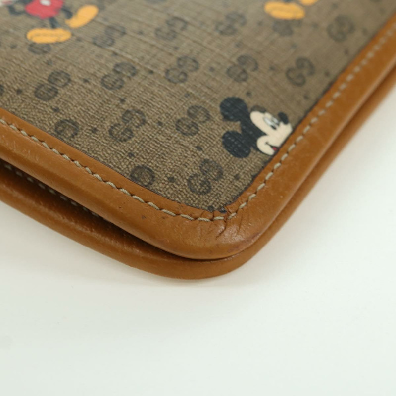 【日本直送】GUCCI GUCCIxDisney GG Supreme 手拿包 PVC 米色金色 602552 正品 YKZ1330M-14