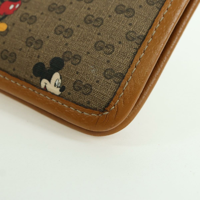 【日本直送】GUCCI GUCCIxDisney GG Supreme 手拿包 PVC 米色金色 602552 正品 YKZ1330M-15