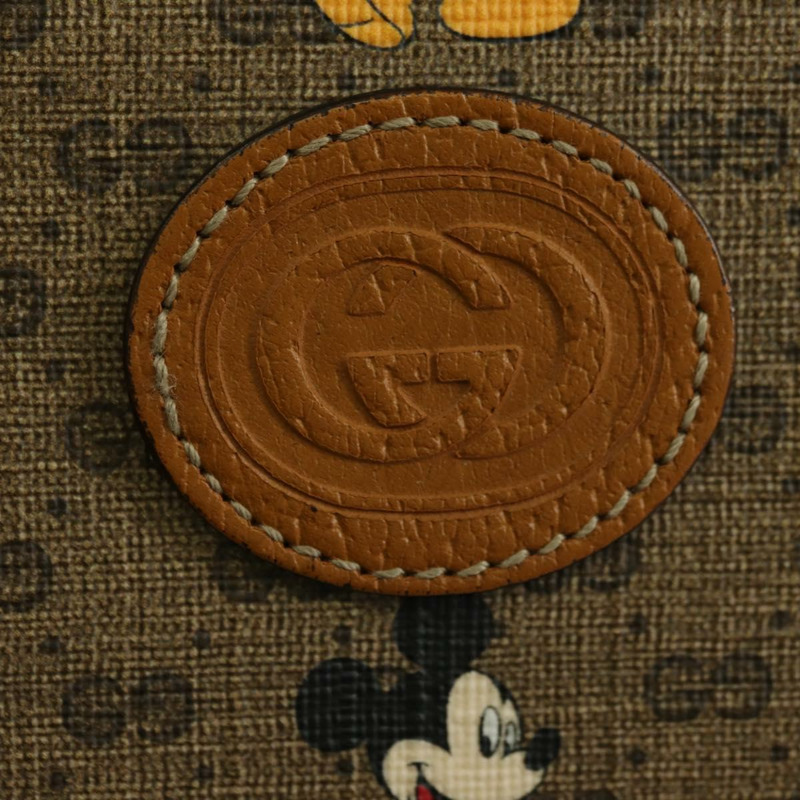 【日本直送】GUCCI GUCCIxDisney GG Supreme 手拿包 PVC 米色金色 602552 正品 YKZ1330M-16