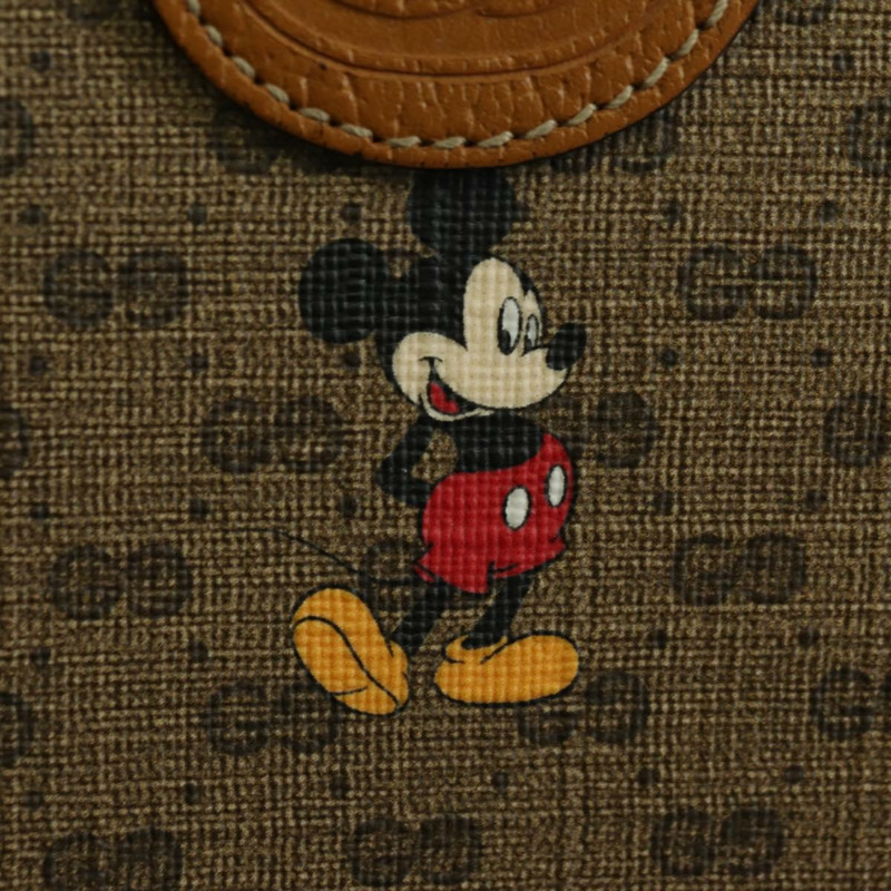 【日本直送】GUCCI GUCCIxDisney GG Supreme 手拿包 PVC 米色金色 602552 正品 YKZ1330M-17