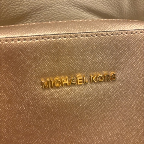 Michael Kors golden leather handbag