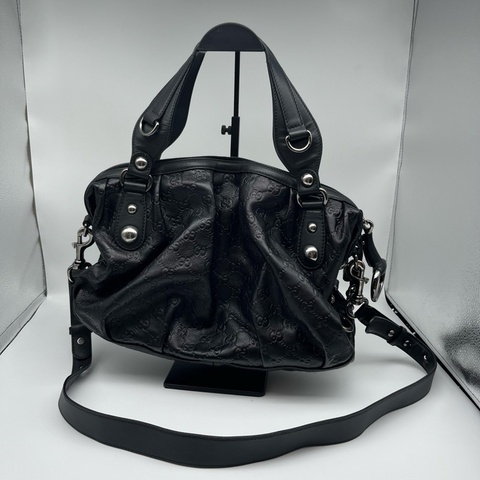 Gucci 古驰 黑色印花手提包斜挎包。