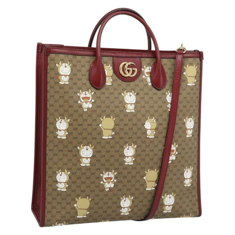 GUCCI哆啦A夢迷你GG手提包 PVC材質 兩用 米色/金色 654345 正品 195107SAM