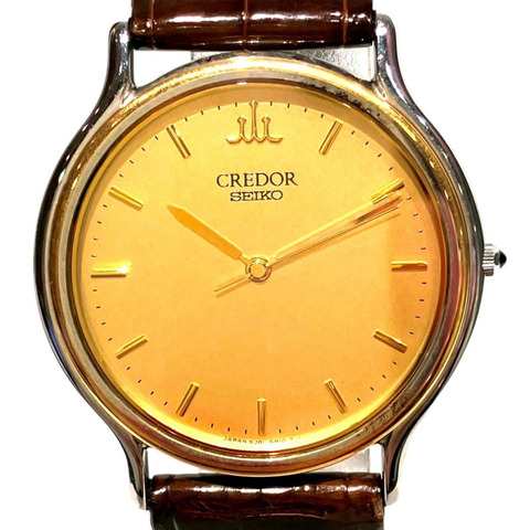 精工 (Seiko) 腕錶，總重 23.2 克，不鏽鋼錶殼搭配黃金色皮錶帶，石英機芯，錶盤，型號 8J81-6B00